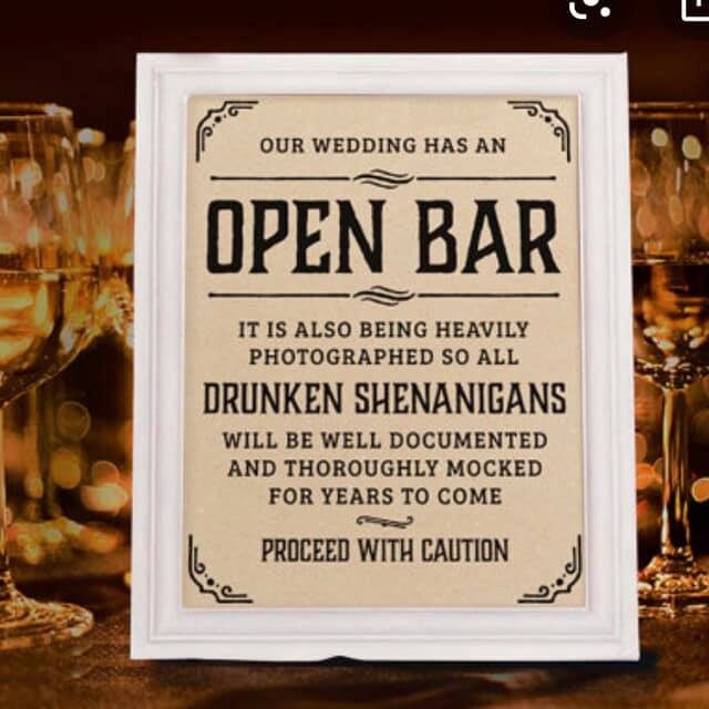 Wine in Glasses and Wedding Sign Wine Poster on a Table
