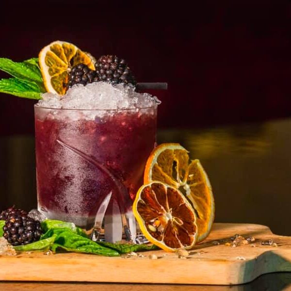 A Sweet Version of a Gin and Tonic Cocktail Made With Blackberries, Mint, and Meyer Lemon